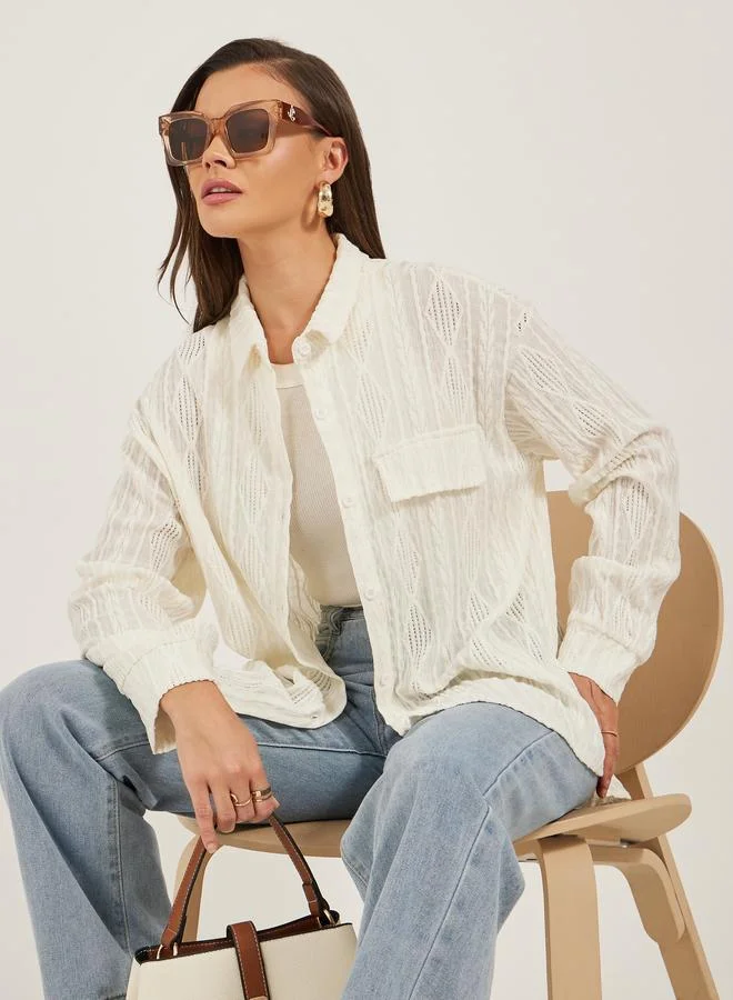 ستايلي بلوزة فضفاضة بتفاصيل بارزة الملمس