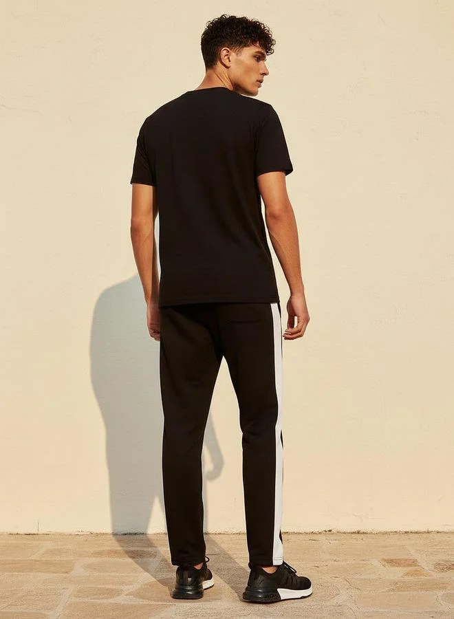 Kappa  KAPPA RELAXED FIT TSHIRT AND BOTTOM SET for Men | Best Price UAE