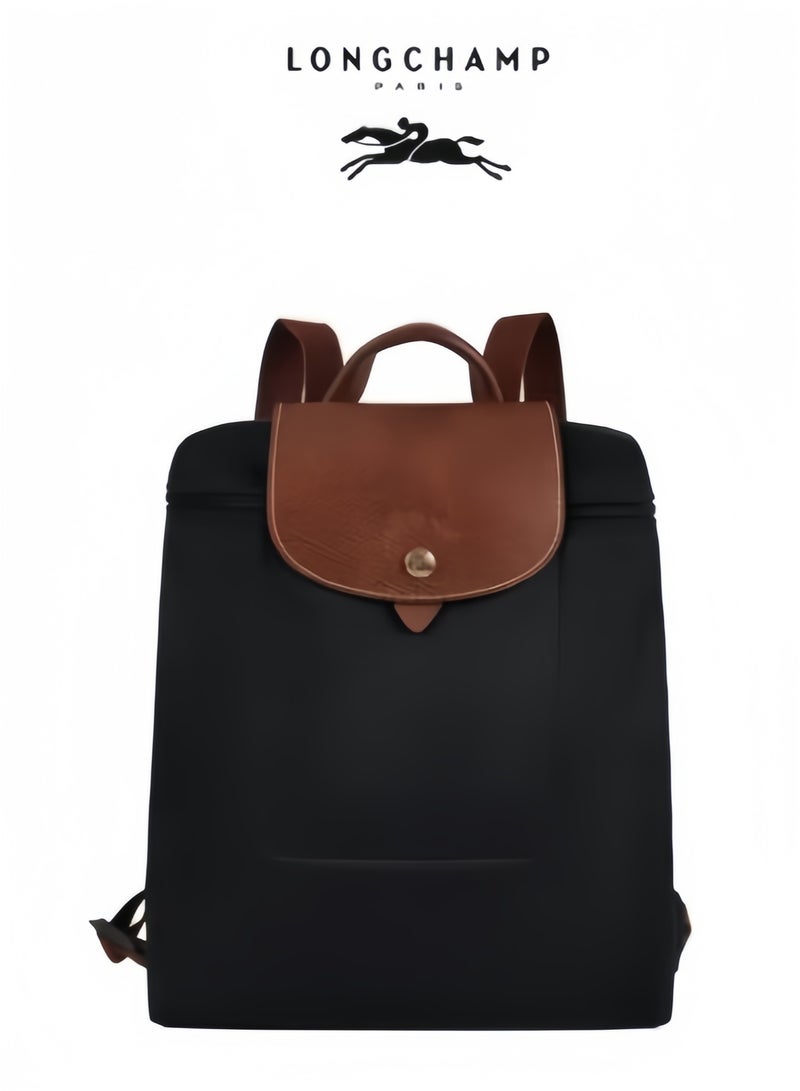 Longchamp Medium backpack with no compartments inside the bag can be used to hold a camera lens. Classic theme pack - Image 1