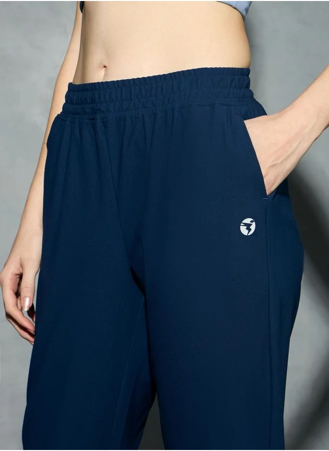 تكنوسبورت Logo Print 4-Way Stretch Joggers with Pockets by Styli