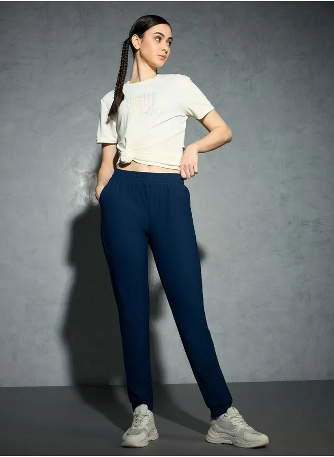 تكنوسبورت Logo Print 4-Way Stretch Joggers with Pockets by Styli