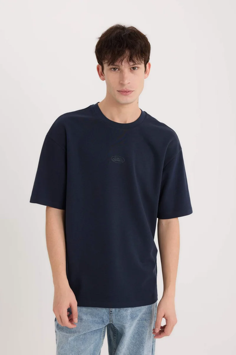ديفاكتو Boxy Fit Crew Neck Printed Short Sleeve T-Shirt