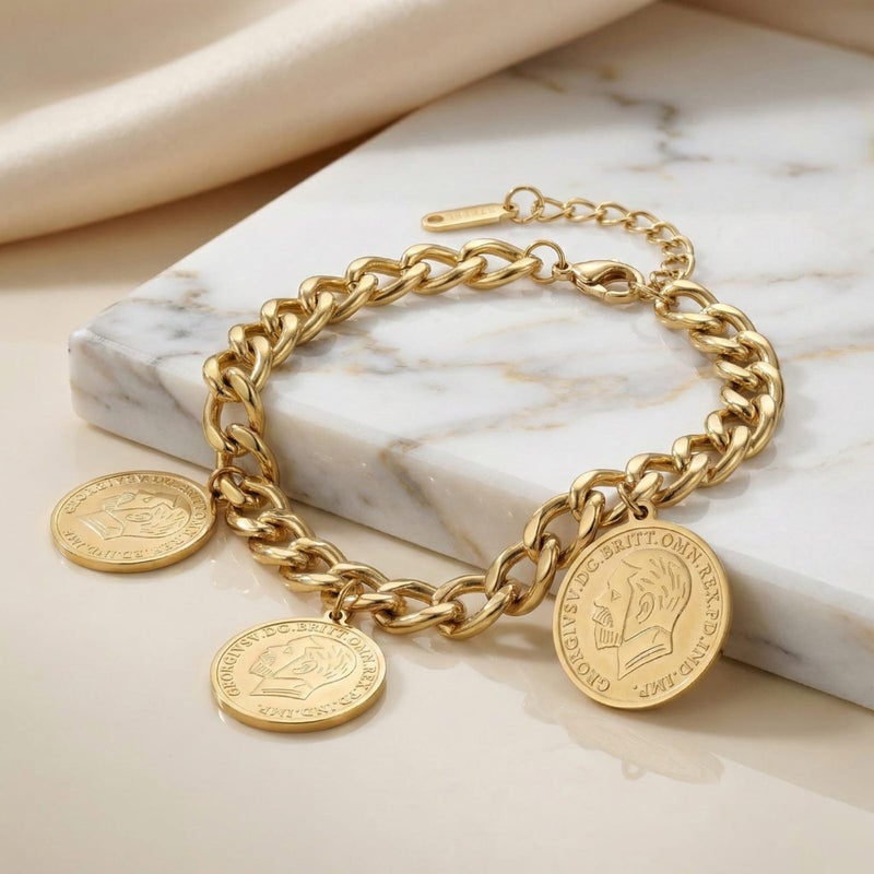 An elegant gold bracelet made of rust-resistant stainless steel, decorated with three classic coins, for a sophisticated and modern look, with an adjustable clasp to suit you. - Image 1