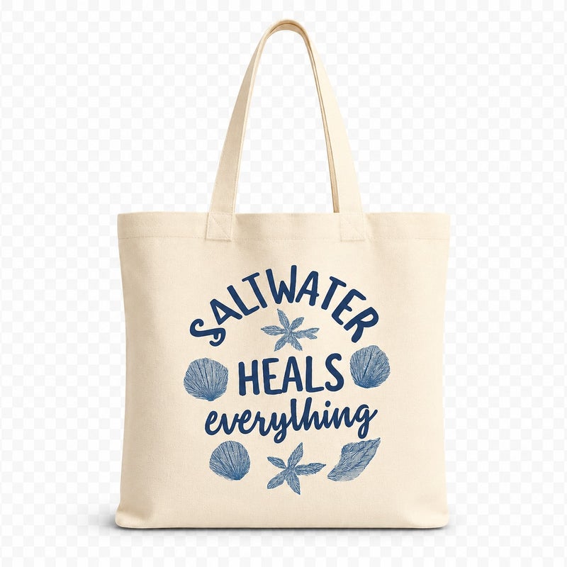 شنطة قماش كانفاس حريمي بطبعة "Saltwater Heals Everything" كحلي بالأصداف، حقيبة صديقة للبيئة قابلة لإعادة الاستخدام للبحر والاستخدام اليومي، مقاس كبير 30×40 سم - Image 1