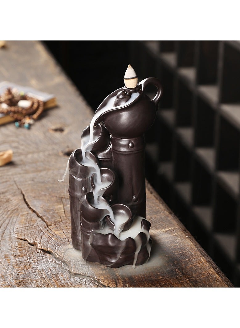 عام محرق معطر خزفي يعيد تدفق الدخان. يوجد على جانبيه مصادر مثل بلوط الحجارة والجداول الجبلية والمآب الجارفة. هو أيضًا زخرفة محرق معطر بالدفق العكسي. - Image 1