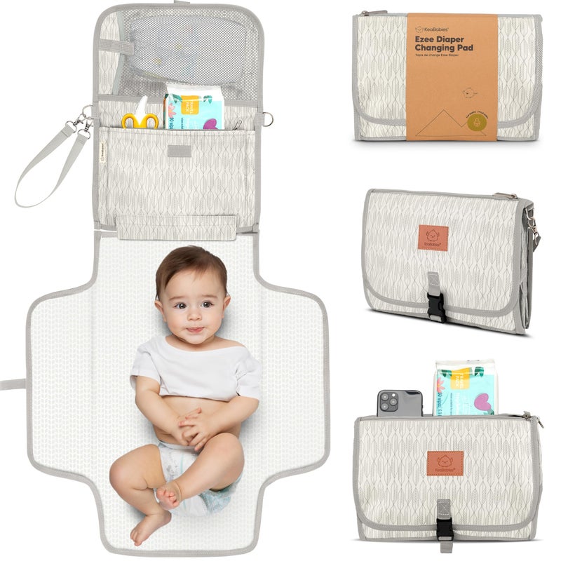 KeaBabies Portable Diaper Changing Pad - Large Waterproof Baby Changing Mat, Compact Travel Diaper Clutch, Functional Pockets Fit Newborn Essentials, Wipeable & Padded Baby Changer (Prism) - Image 1