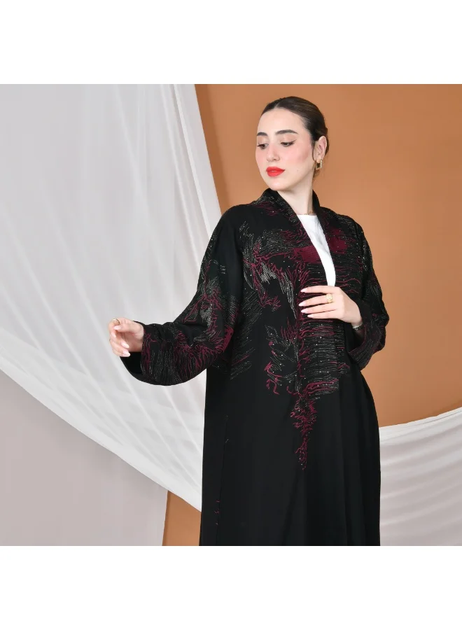 HAWRAA ABAYA Black wrap abaya with a flowing cut, gold and burgundy embroidery, decorated with stones