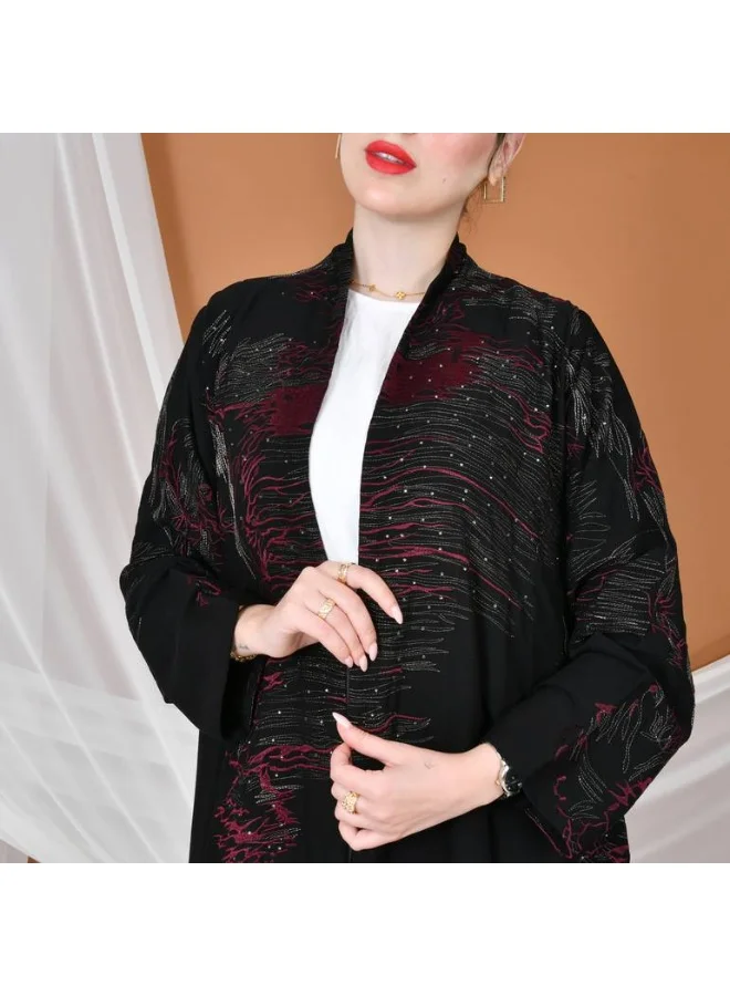 HAWRAA ABAYA Black wrap abaya with a flowing cut, gold and burgundy embroidery, decorated with stones