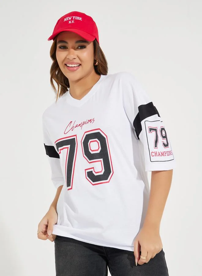 Styli Oversized Slogan Print V Neck T-Shirt with Exaggerated Sleeve