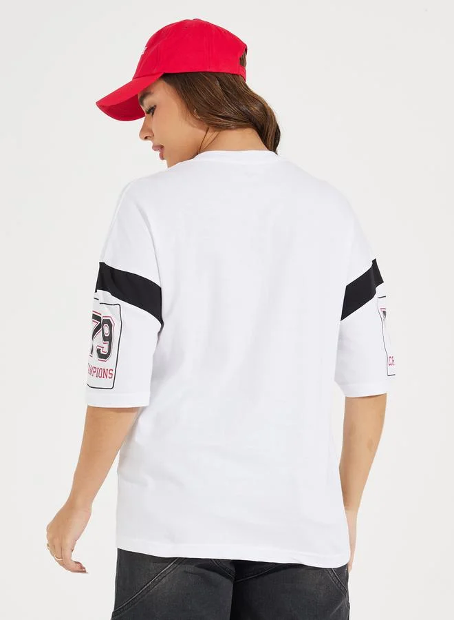 Styli Oversized Slogan Print V Neck T-Shirt with Exaggerated Sleeve