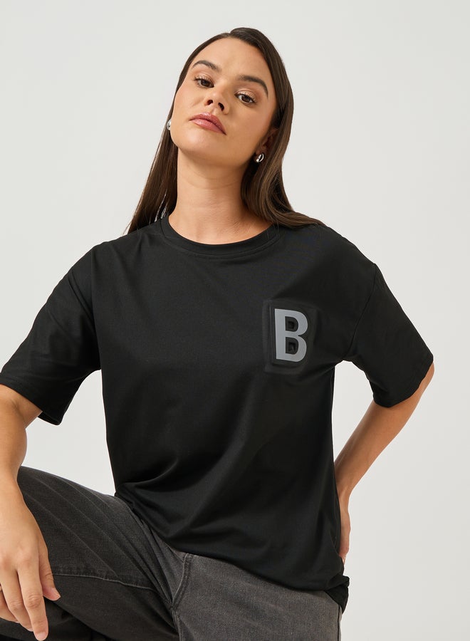 Styli Solid Round Neck T-Shirt with Badge Detail - Image 1