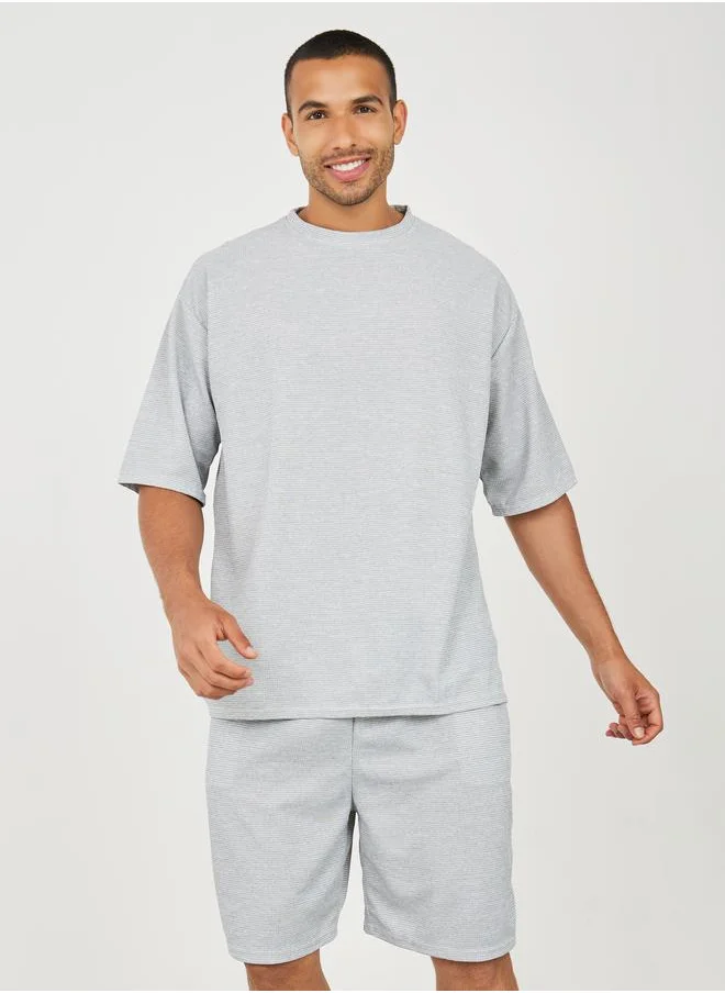 ستايلي Solid Textured Knit Oversized Streetwear T-Shirt & Shorts Set