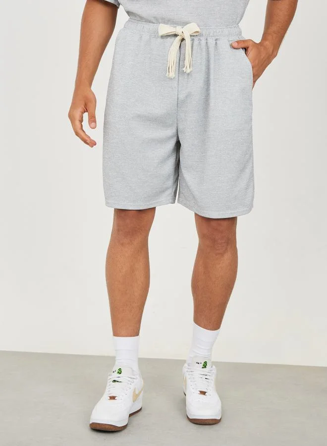 ستايلي Solid Textured Knit Oversized Streetwear T-Shirt & Shorts Set