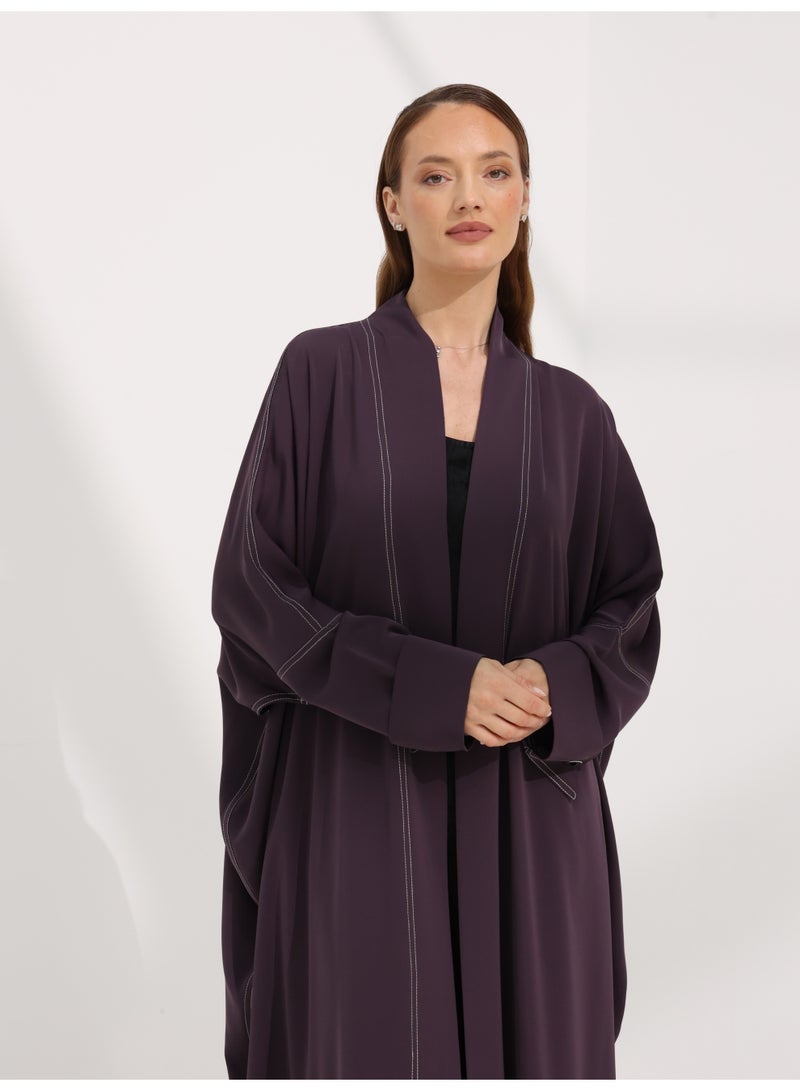 Khan&Co. Seven Seas Ube Cake Abaya in purple crepe fabric with two gold KHAN&CO logo buttons - Designed by Abdullah Khan - Image 2