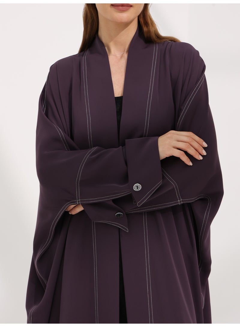 Khan&Co. Seven Seas Ube Cake Abaya in purple crepe fabric with two gold KHAN&CO logo buttons - Designed by Abdullah Khan - Image 3