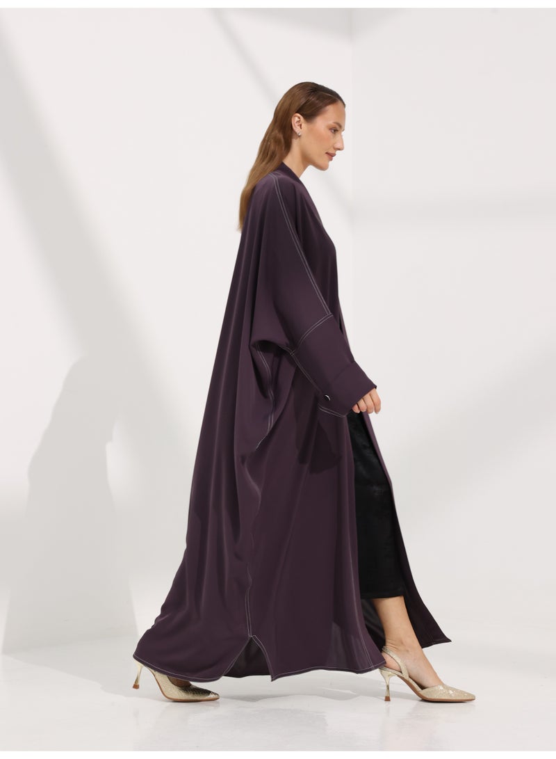 Khan&Co. Seven Seas Ube Cake Abaya in purple crepe fabric with two gold KHAN&CO logo buttons - Designed by Abdullah Khan - Image 5