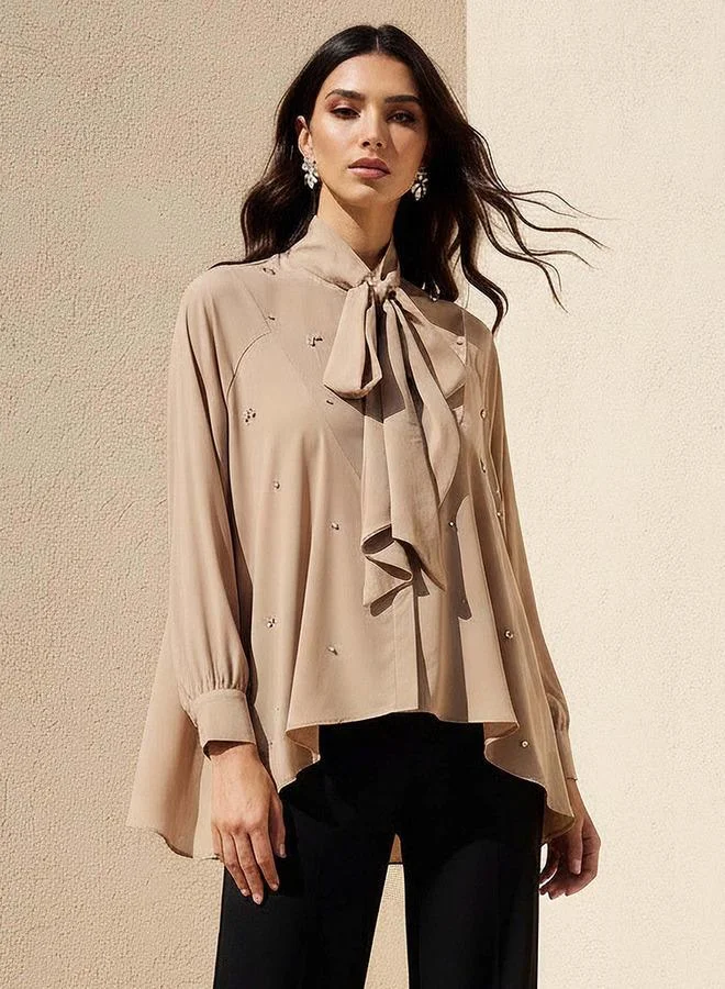 ايكونيك توب أيقوني بقصة مريحة وزخارف حجر الراين