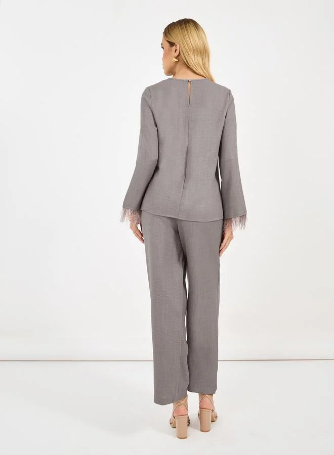 Styli Solid Top with feather trim Sleeves & Wide Leg Pants Co-Ords Set