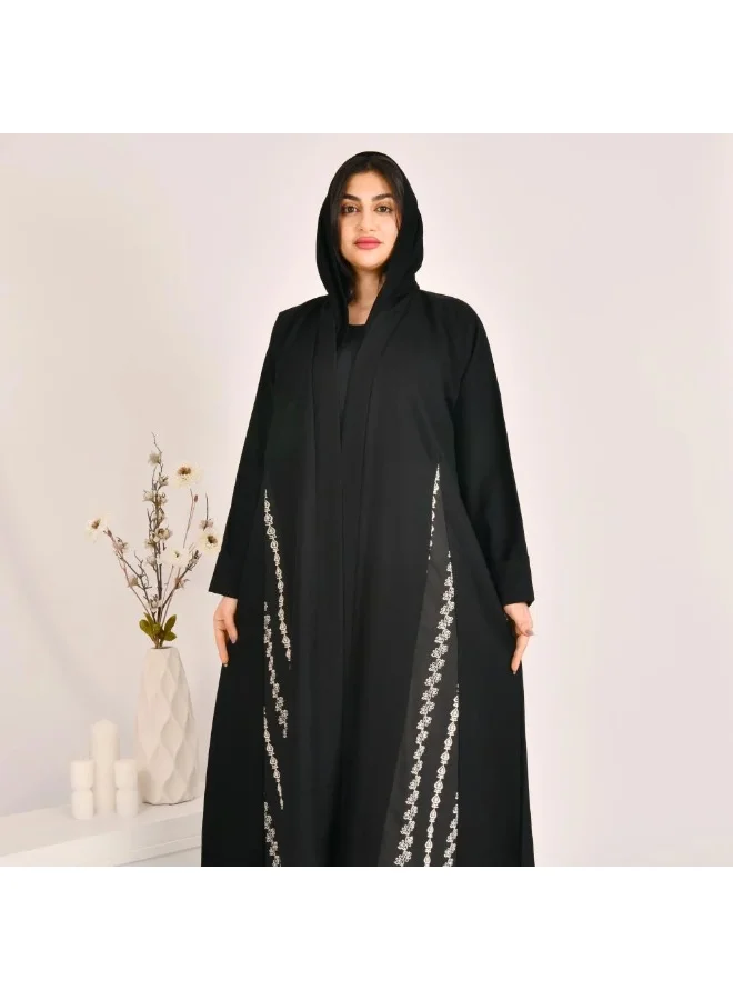 lamha abaya Black cloche abaya with striped jacquard fabric and white embroidery