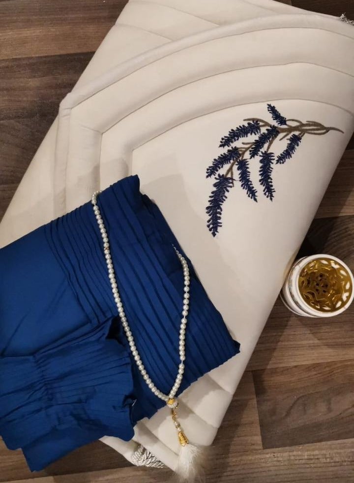 A distinctive and wonderful prayer set consisting of (a prayer rug lined and embroidered with lavender + a prayer dress with wonderful pleats + a rosary of beads) 