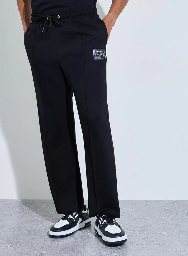 ستايلي Men's Black Oversized Joggers with Badge Detail