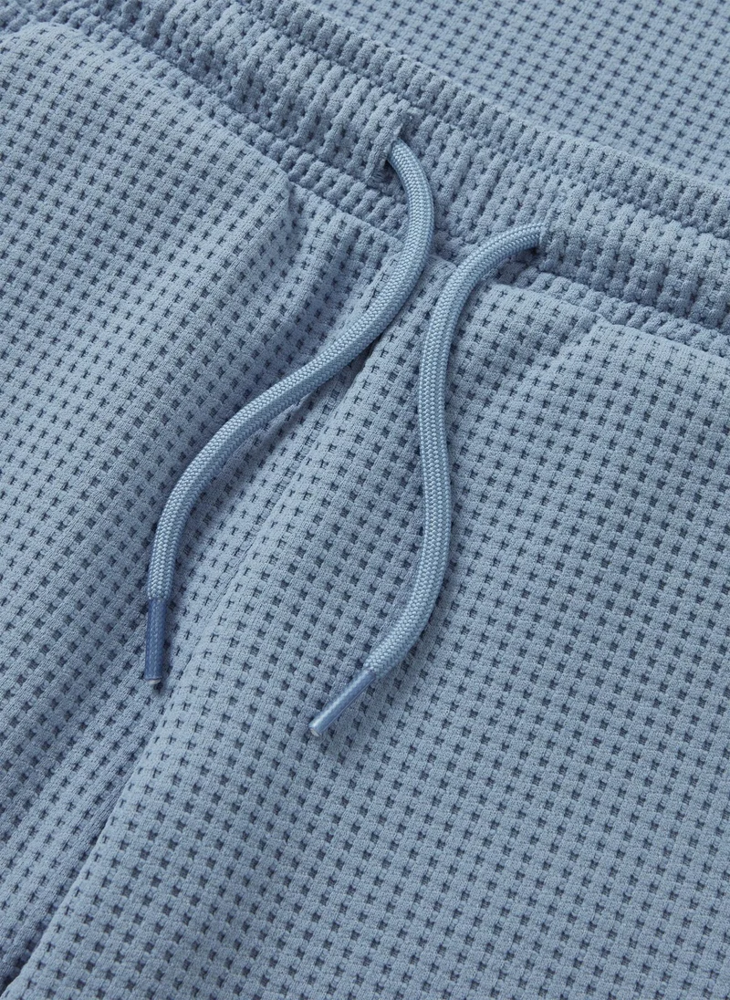 ماتلان طقم ولادي بلوزة وشورت وافل أزرق