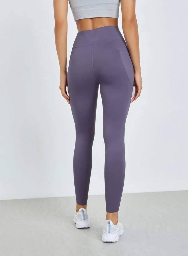 Styli Active Purple Purple Broad Waist Side Pocket Leggings for Women | Best Price UAE