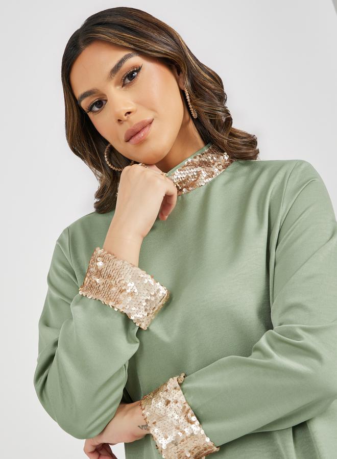 ستايلي جلابية مزينة بالترتر بياقة عالية - Image 4