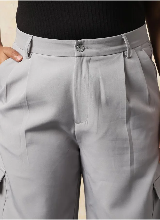 هاي ستار Women Trousers in Grey featuring Wide Leg fit with a solid pattern, regular length, secured with button closure, crafted from 95% polyester 5% spandex – a stylish must-have for any occasion.