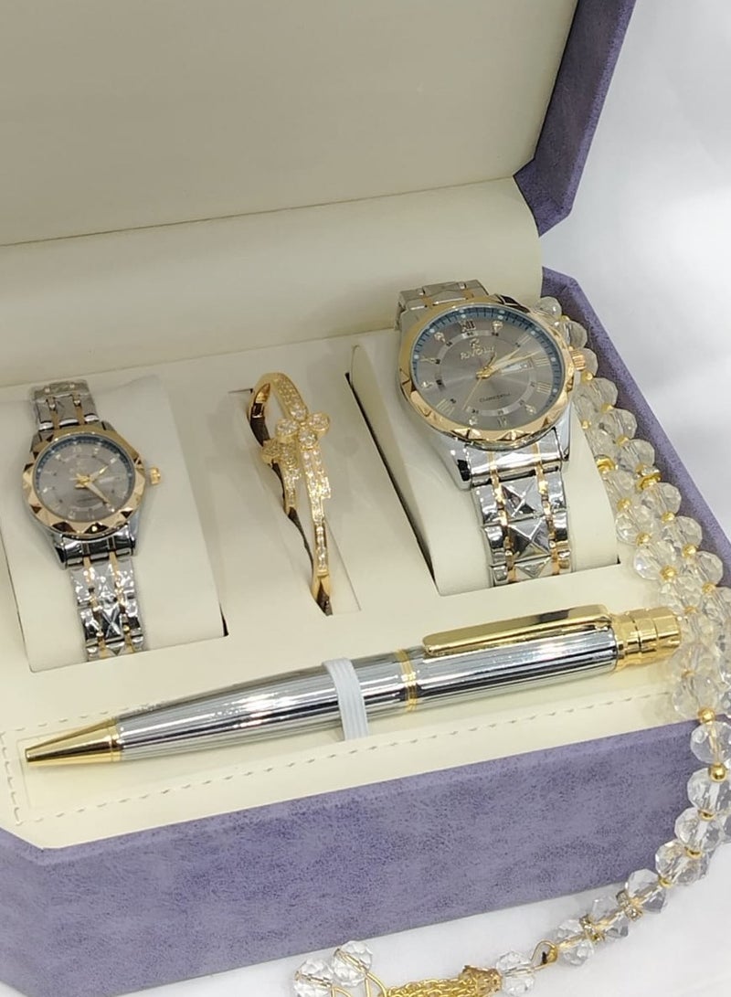 Watch set consisting of a men's watch, a women's watch, a pen, a bracelet, and a ring.