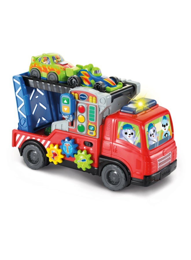 vtech 3-in-1 Musical Car Carrier Truck Toy with Repair Center, Pull-Along Cord & 2 Race Cars for Toddlers (12–36 Months) - Image 1