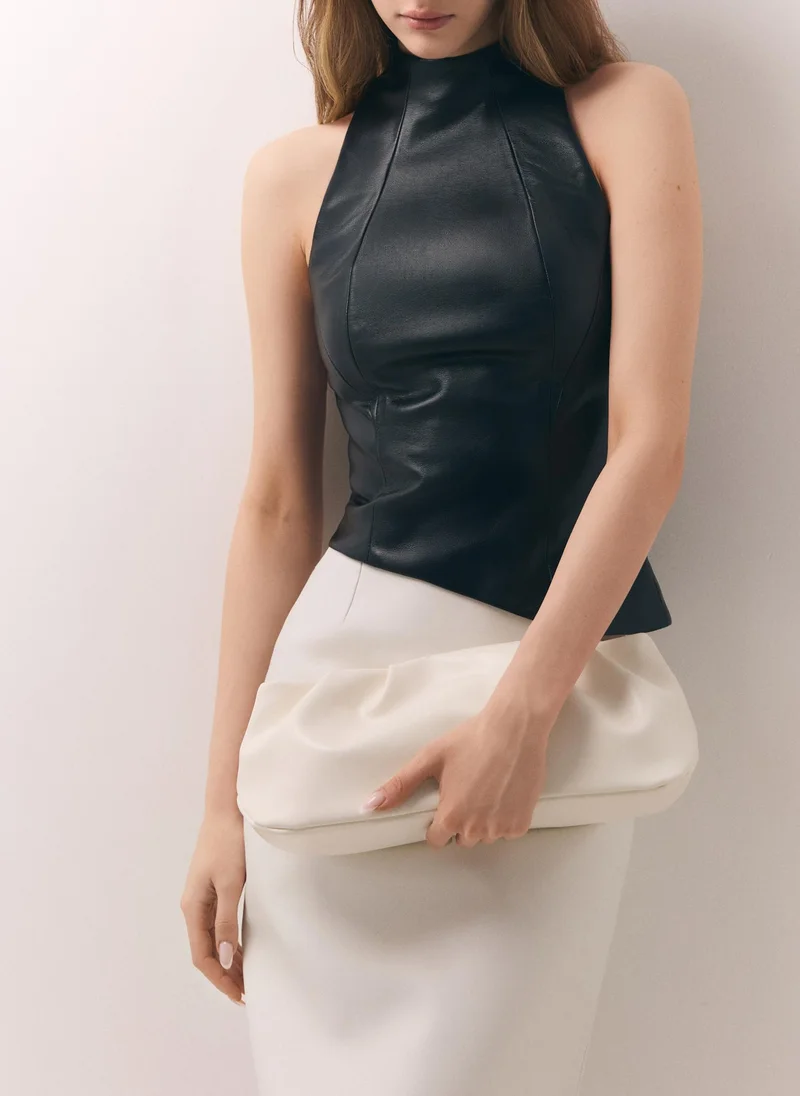 Voluminous eco-leather clutch bag with a thin strap