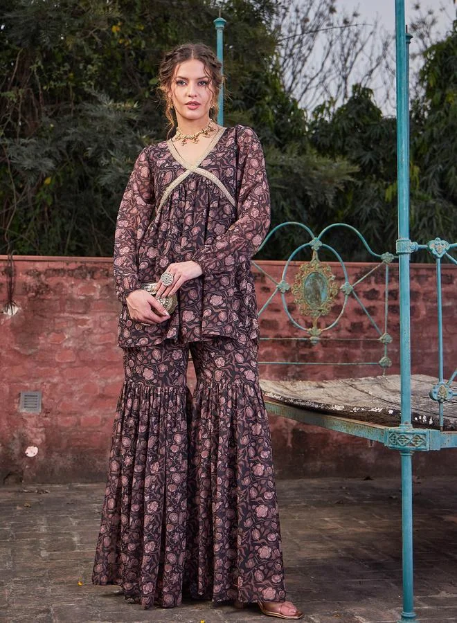 SASSAFRAS SASSAFRAS Black Floral Print V-Neck Peplum Top with Sharara Pants Set