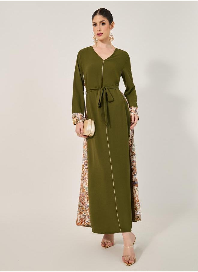 Styli - navy olive colour jalabiya w/ navy blue pailsey print inserts at sides and slv cuff w/ gold cord trim at CF and sleeve hem - Image 1