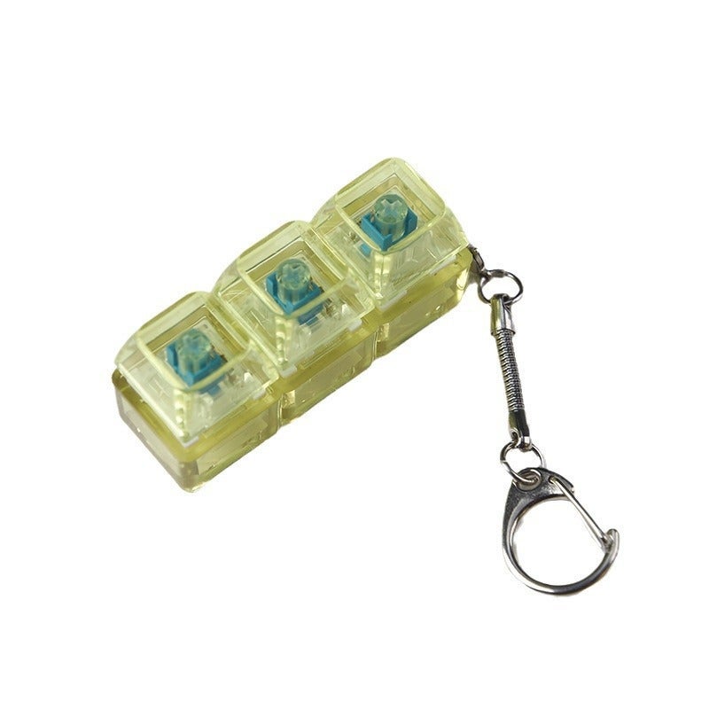 PC fully transparent material decompression shaft tester press sound crisp 2 holes 3 holes 4 holes key chain with light transparent cap 3-hole yellow with light * 1