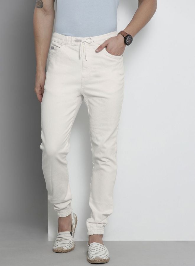 The Indian Garage Co Men Slim Fit Solid Mid-Rise Stretchable Denim Joggers  - Image 1