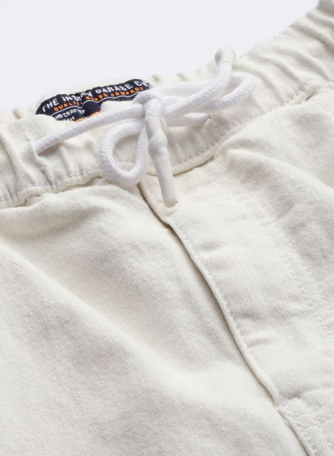 The Indian Garage Co Men Slim Fit Solid Mid-Rise Stretchable Denim Joggers