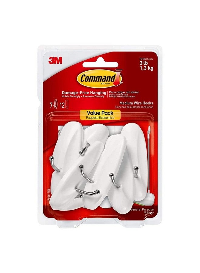 كوماند خطافات سلكية متوسطة الحجم من كوماند، خطافات حائط معلقة خالية من التلف مع شرائط لاصقة، خطافات حائط بدون أدوات لتعليق الزخارف في أماكن المعيشة، 7 خطافات بيضاء و12 شريط كوماند - Image 1
