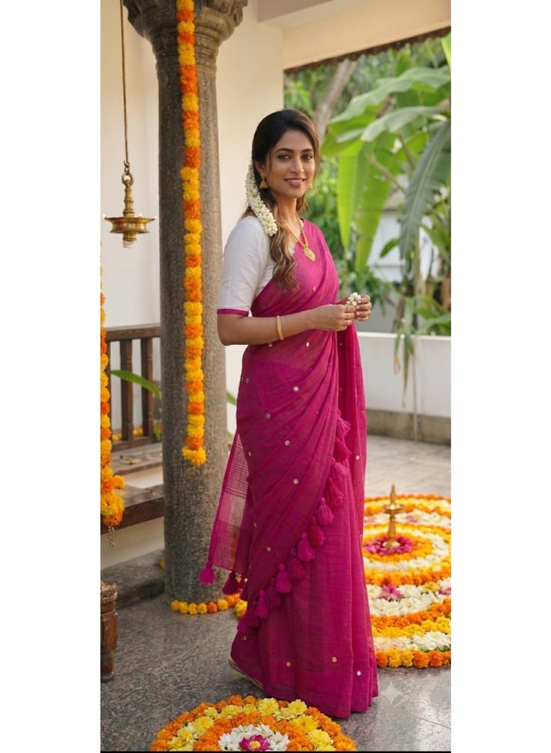 Dark rani pink khadi cotton saree, featuring delicate tassels and subtle mirror work on the pallu. "Crafted for special occasions, this saree exudes elegance and charm, making it an ideal choice for weddings and festive gatherings." - Image 1