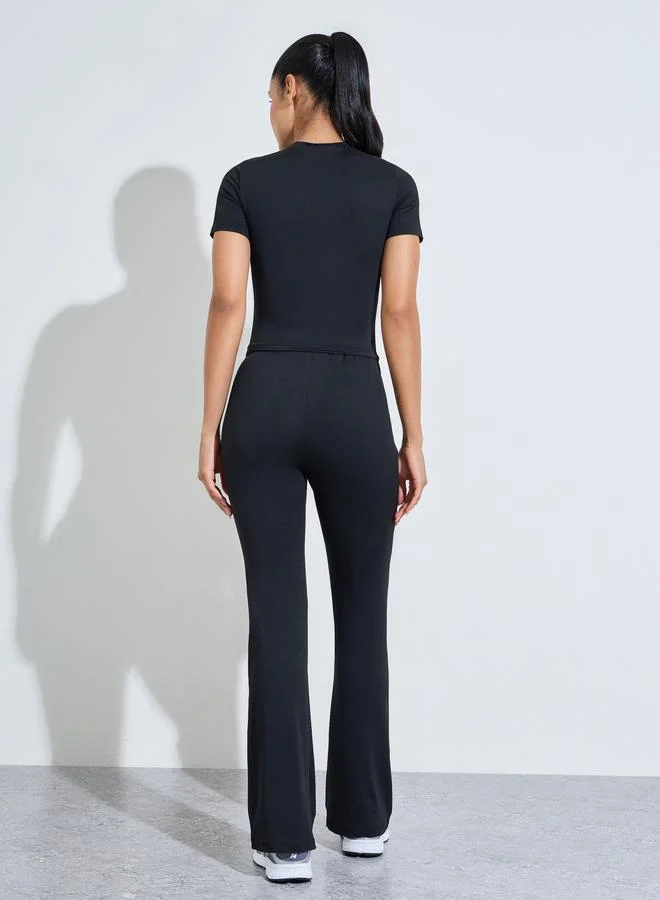 Styli Active  Black Solid Fitted T-Shirt And Flared Pants Active Set for Women | Best Price UAE