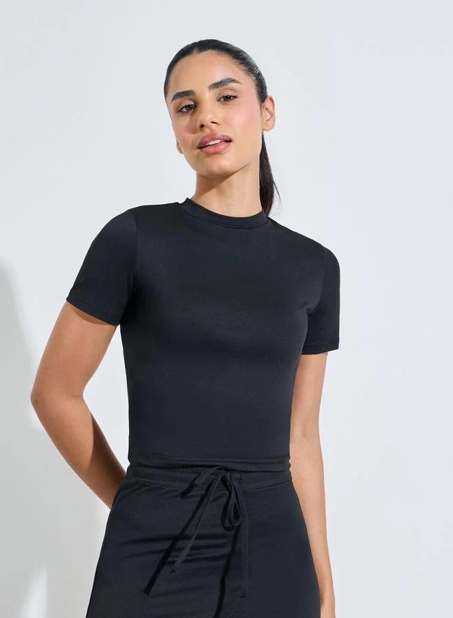 Styli Active  Black Solid Fitted T-Shirt And Flared Pants Active Set for Women | Best Price UAE
