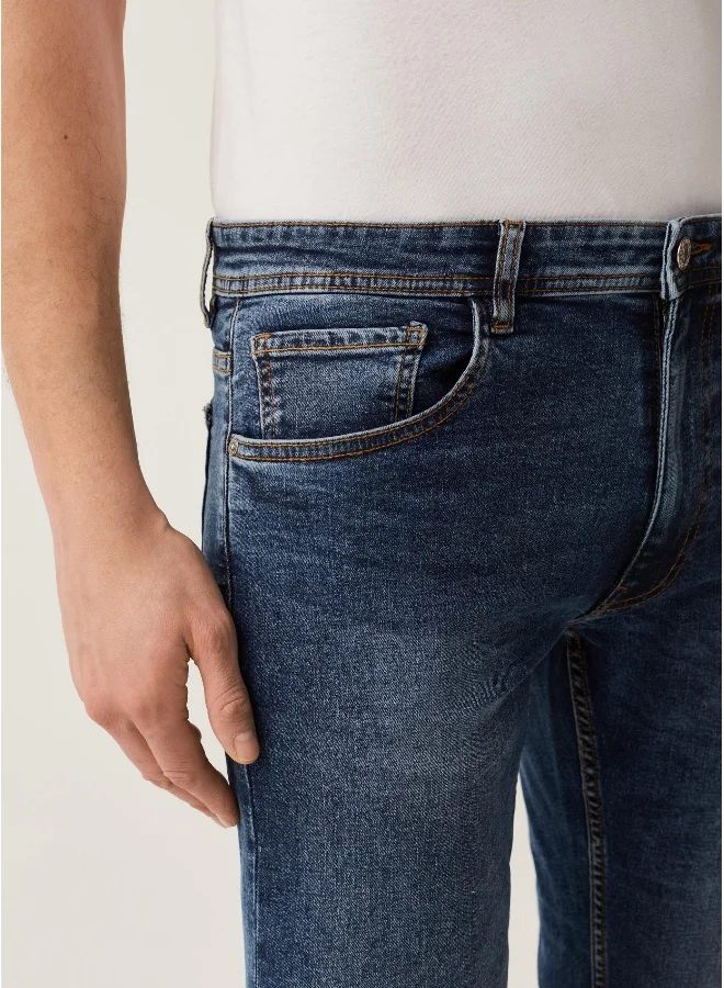 او في اس Faded, slim-fit stretch jeans