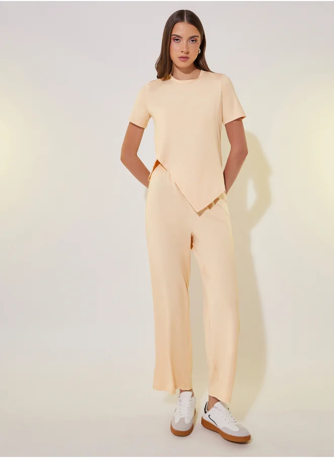 Styli Asymmetrical Hem Short Sleeve T-Shirt and Pants Co-Ords