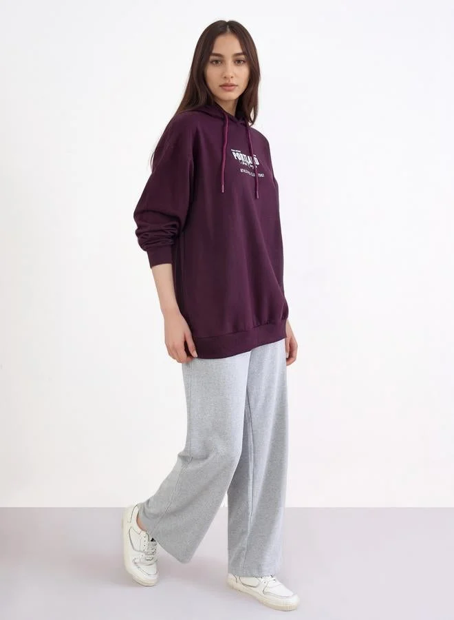 Styli Styli Purple Longline Hoodie with Slogan Print
