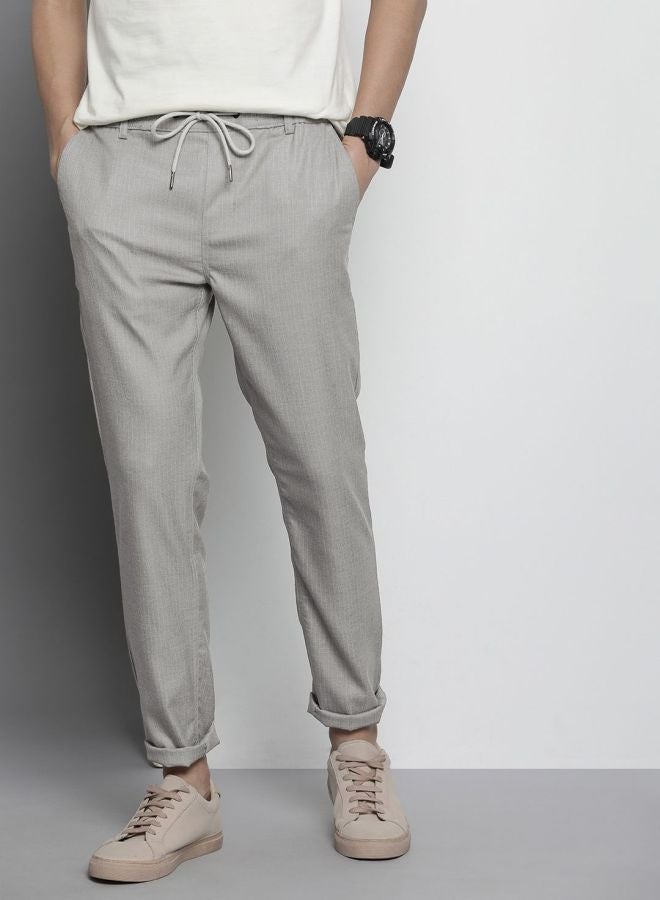 The Indian Garage Co Men Regular Fit Self Design Mid-Rise Stretchable Jogger Trousers  - Image 1