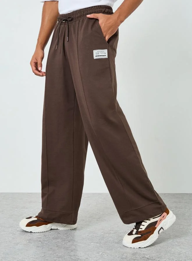 Men Brown Wide Leg Joggers with Pintuck Detail