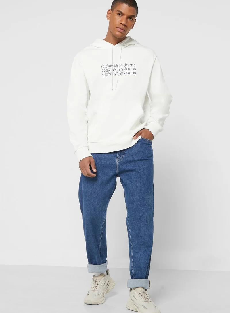 CALVIN KLEIN Mid Wash Tapered Fit Jeans