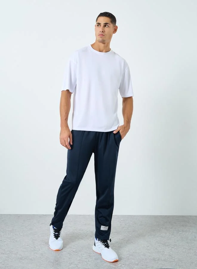 Styli Styli Ultra Soft Slim Pintuck Athleisure Joggers with Badge Detail