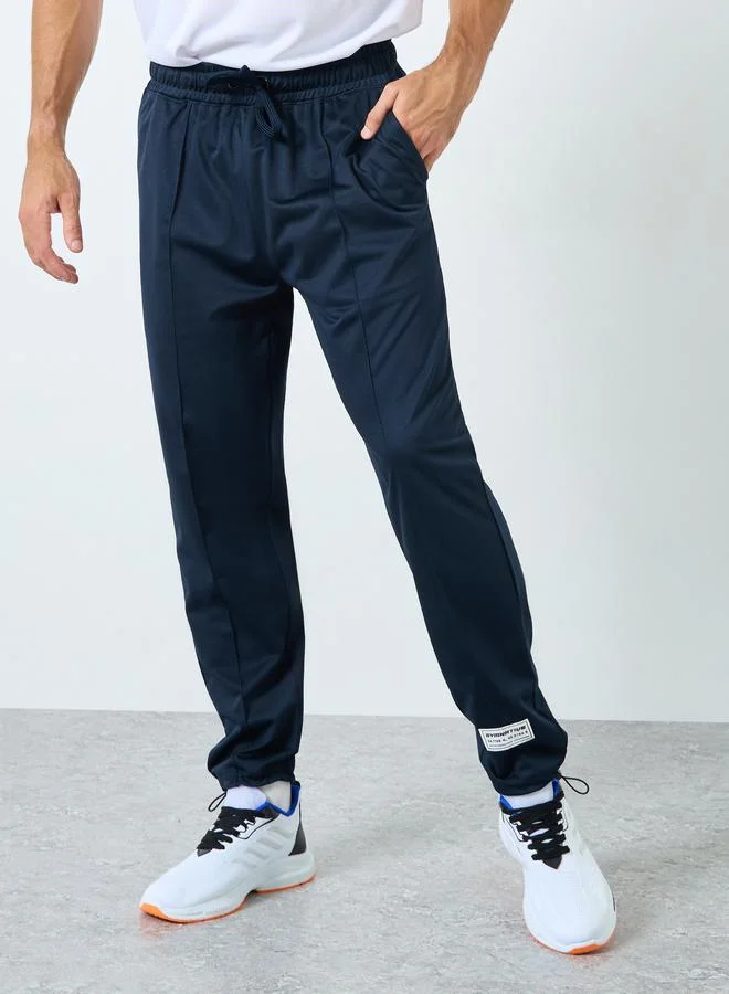 Styli Styli Ultra Soft Slim Pintuck Athleisure Joggers with Badge Detail
