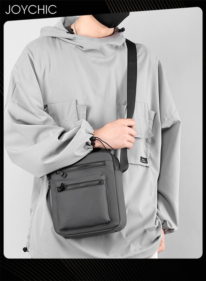 Joychic حقيبة كروس بودي مقاومة للتآكل بتصميم بسيط غير رسمي للرجال، حقيبة كتف متعددة الجيوب بسعة كبيرة مع أحزمة قابلة للتعديل للهاتف وجواز السفر باللون الرمادي - Image 1